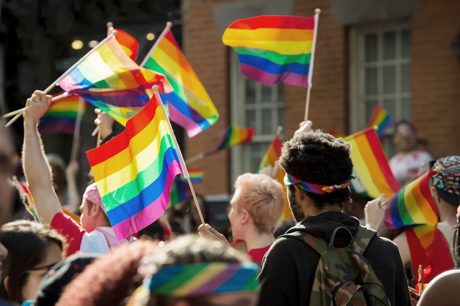 TREC Outreach & Community Page - a group of people at a pride parade